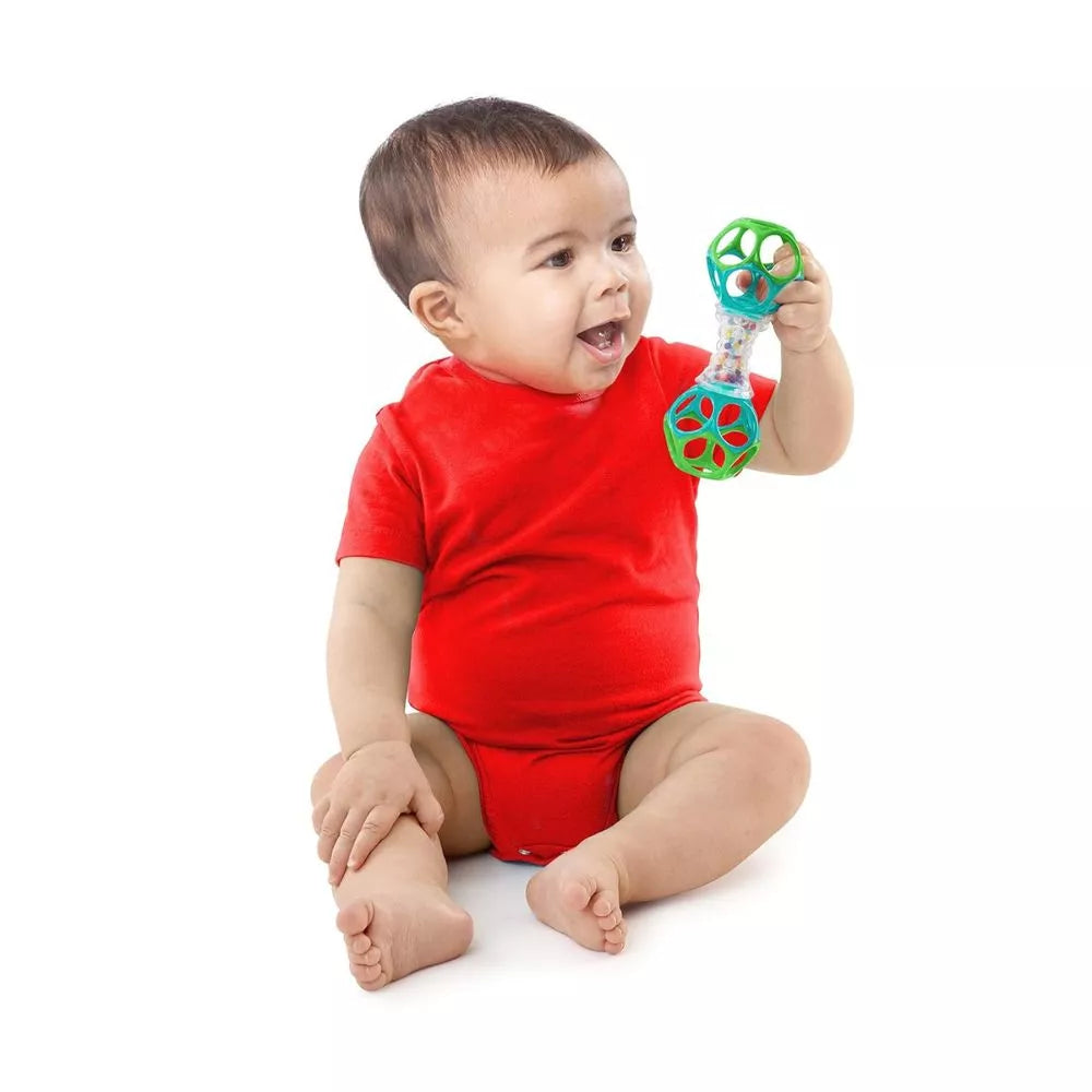 Bright Starts Oball Shaker Rattle Toy held by baby for sensory and grasping play
