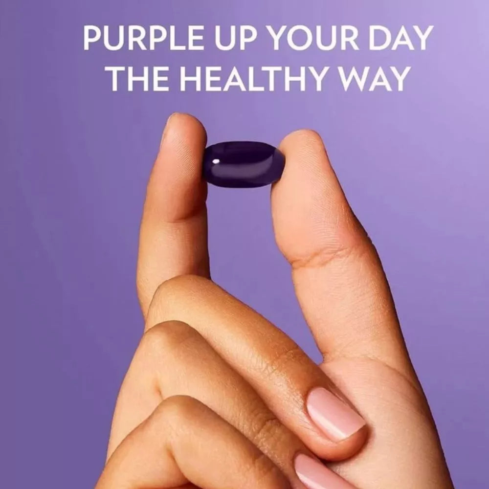 Nu Skin ageLOC Meta softgel supplement held between fingers