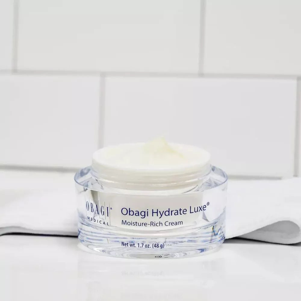 Obagi Hydrate Luxe Moisture-Rich Cream jar on bathroom counter